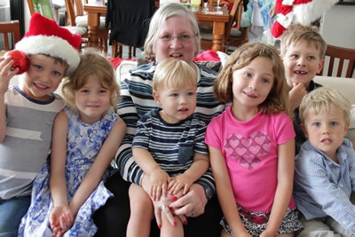 Photo of Cassandra with her grandchildren