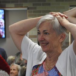 Photo of Sue Evershed with hands on her head