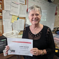 Photo of Lynn with her certificate